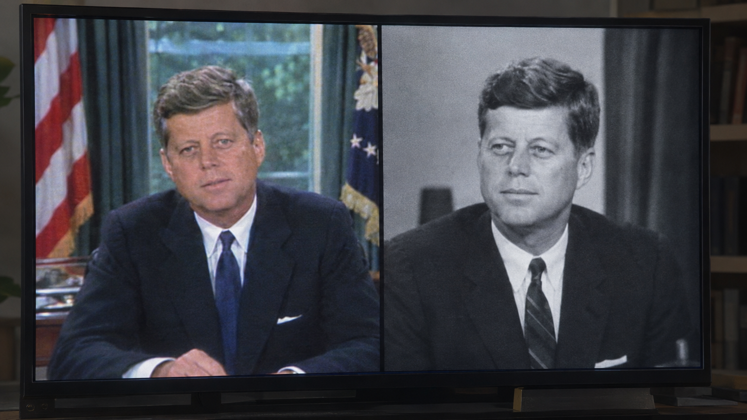 A two-panel split-screen television monitor from 2018 comparing a grainy color 1968 broadcast of a grey-haired, healthy President John F. Kennedy at the Oval Office desk with a black-and-white 1963 archival photograph of a younger Kennedy